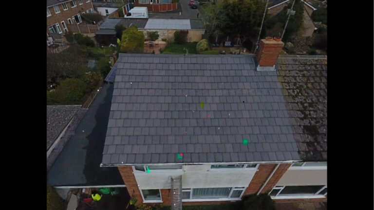 Aerial view of grey coloured shingle rood recently soft washed