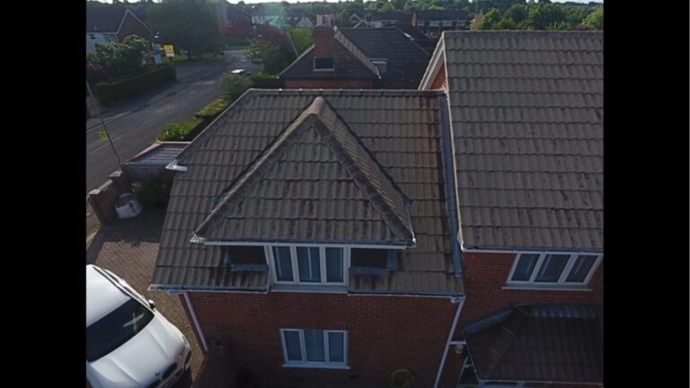 residential roof recently soft washed drying in the sun