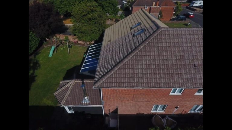 UK home roof being soft washed progress picture