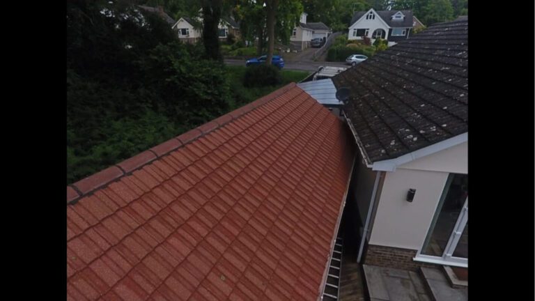 Red tiled garden building clean adjacent to dirty home roof