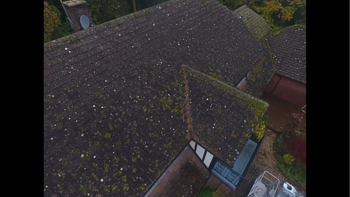 Aerial shot of a UK home covered in moss