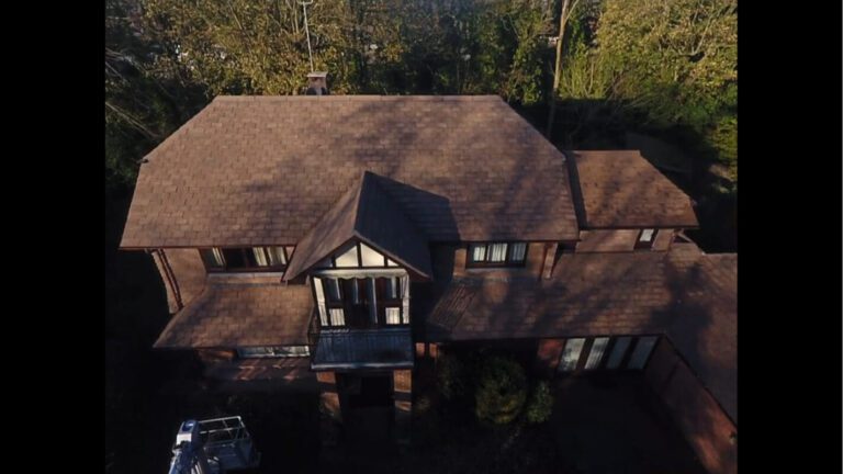 Frontal view of soft wash tiled roof on bricked finished home