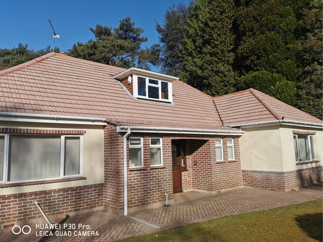 soft washed red tiled bungalow roof shining in the sun