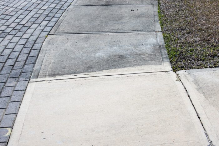 Pavement outside home or business in process of being cleaned