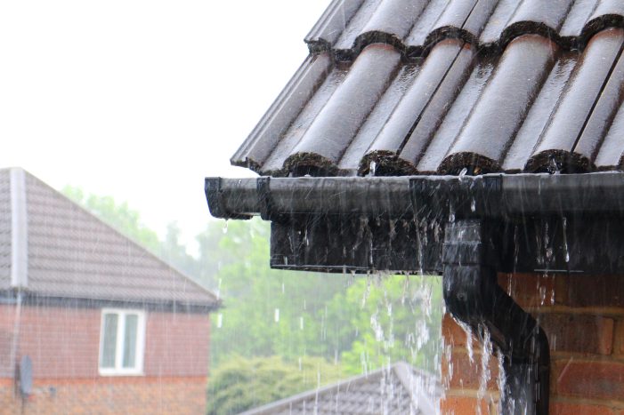 Black gutters during a rainstorm working as intended