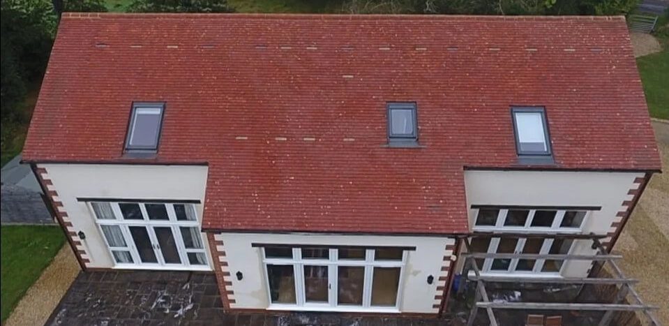 red tiled roof recently cleaned via soft wash restoration